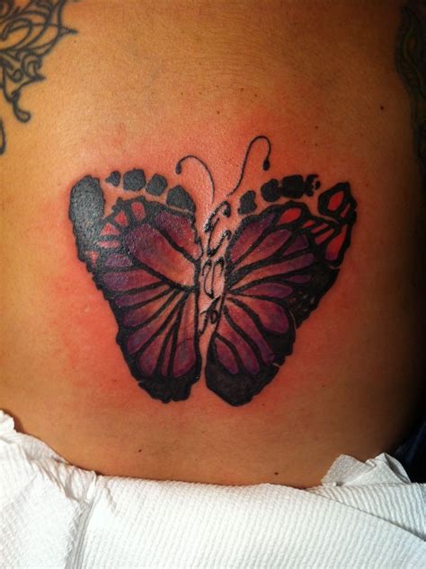 Fluttering Beauty: Mesmerizing Footprint Butterfly Tattoo Design